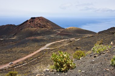 Road through volcanic landscape at La Palma clipart