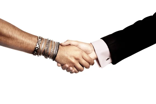 Kézfogás üzletember és alternatív ember között Stock Fotó