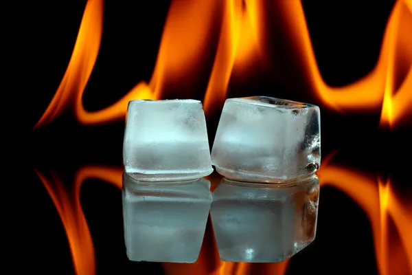 Ice cubes and fire — Stock Photo, Image
