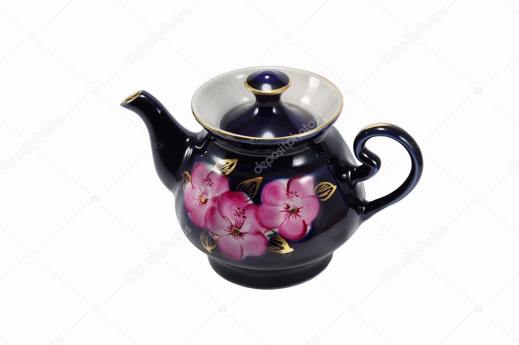 Porcelain teapot with painted flowers on the white background