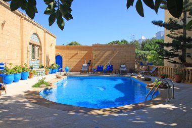 The swimming pool in Moroccan hotel. clipart