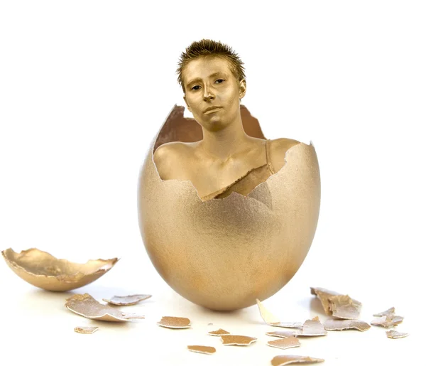 Golden woman from an egg — Stock Photo, Image