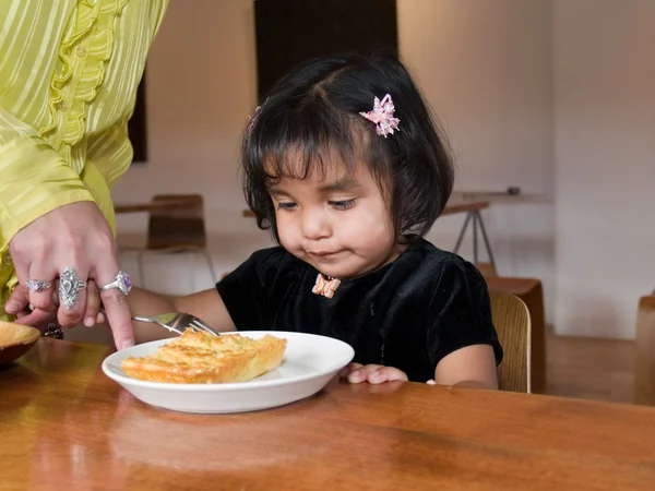 stock image Little Native American girl eating quiche