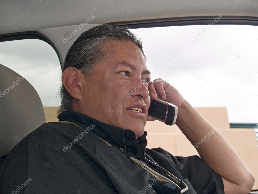 Native American man talking on cell phone