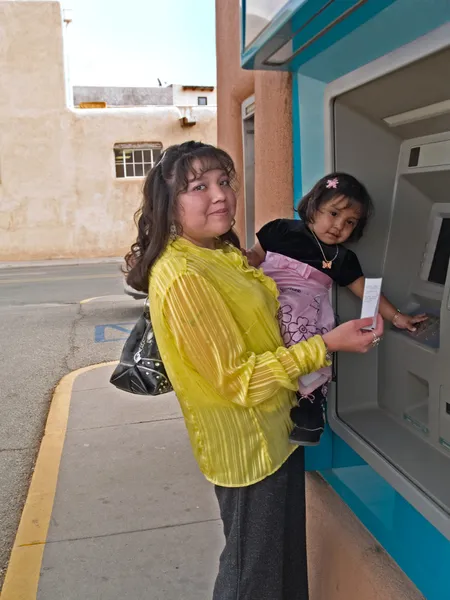 Native American woman at an ATM — Stock Photo, Image