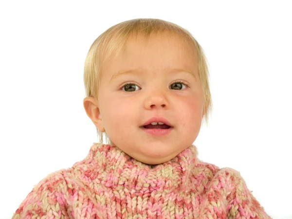 Niedliches Kleinkind im rosa Pullover — Stockfoto
