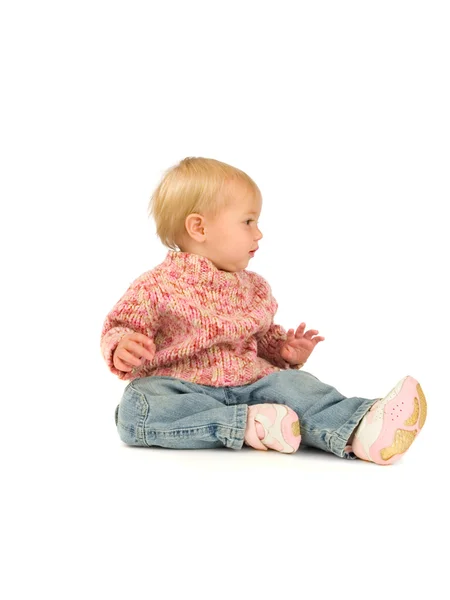 Klein meisje in roze trui — Stockfoto