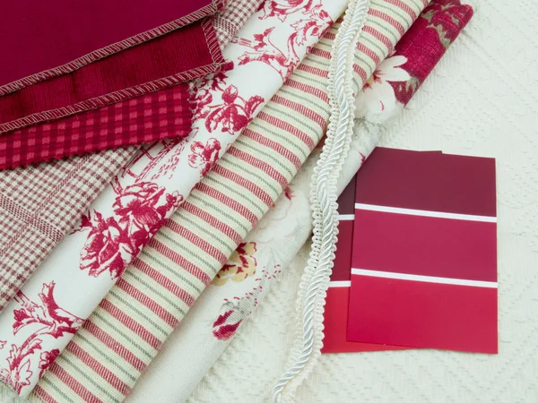 Red & white fabric and paint swatches — Stock Photo, Image