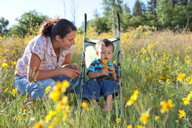 Mother and son enjoying late summer afternoon clipart