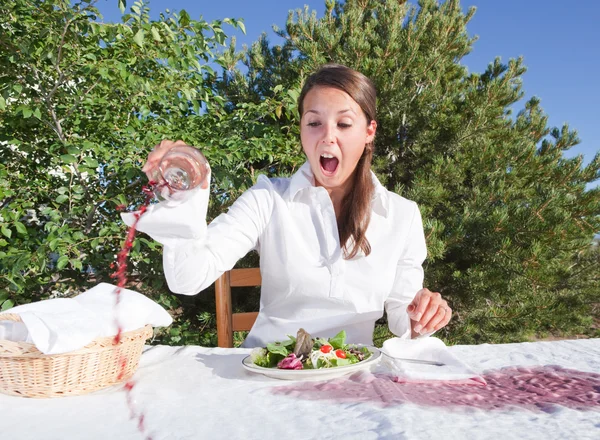 Woman spilling wine — Stock Photo, Image