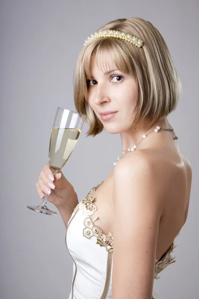 Girl in evening dress with a glass — Stock Photo, Image