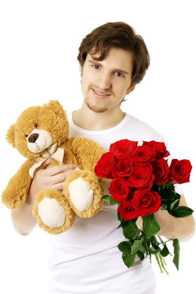 Mann, der Bären und einen Strauß Rosen schenkt — Stockfoto