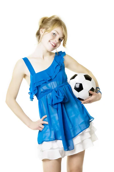 Blond girl in a blue dress with soccer ball — Stock Photo, Image