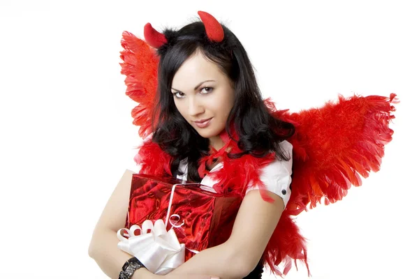 Flicka i en devil kostym med en gåva — Stockfoto