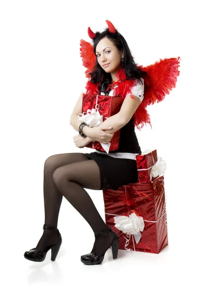 Menina em um traje do diabo com um presente — Fotografia de Stock