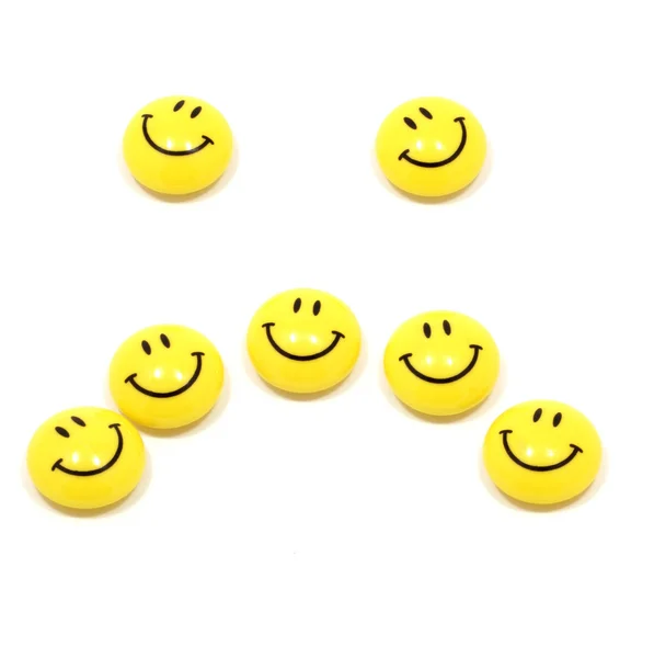 Грустное лицо с желтыми улыбками — стоковое фото