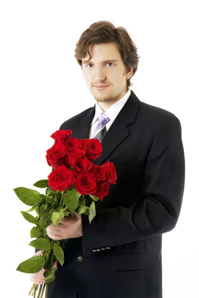 Mooie man met een boeket rozen — Stockfoto