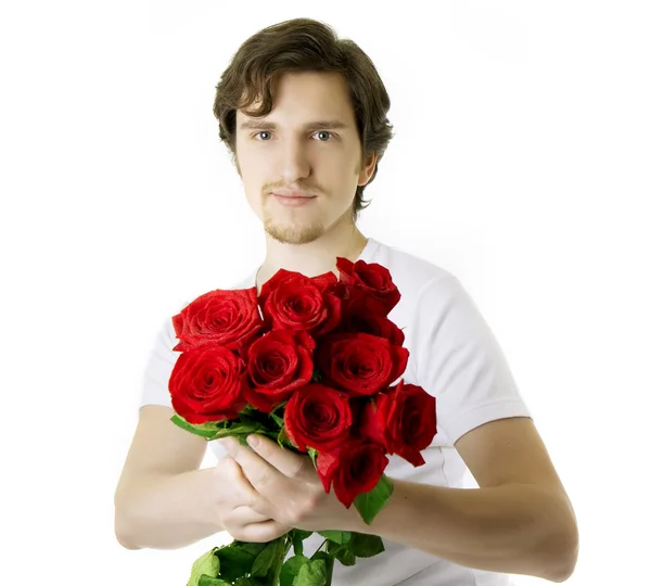 Όμορφο άνθρωπος με ένα μπουκέτο από τριαντάφυλλα — Φωτογραφία Αρχείου