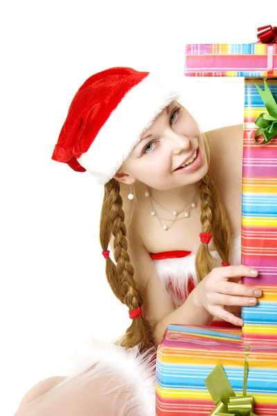 Санта-девочка с подарками на белом фоне — стоковое фото