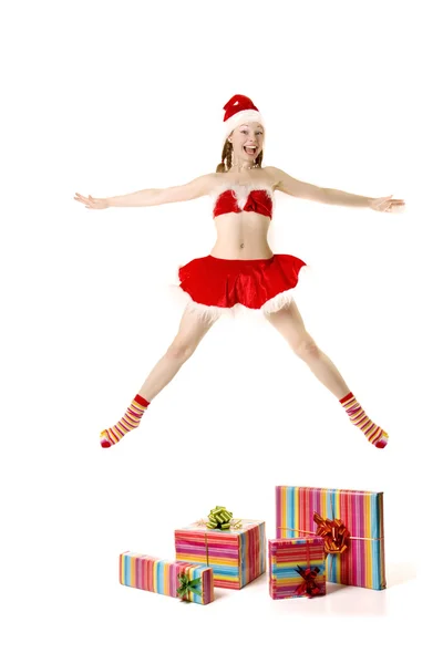 Santa dziewczyna z prezentuje się na tle — Zdjęcie stockowe