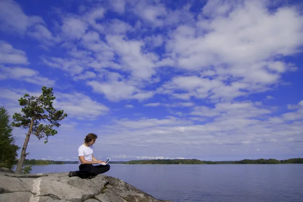 stock image Man with a laptop in an outdoor