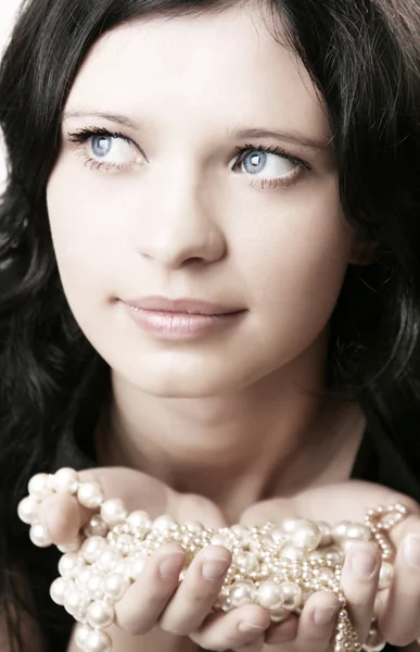 Girl model rope of pearls in the hands of Stock Photo