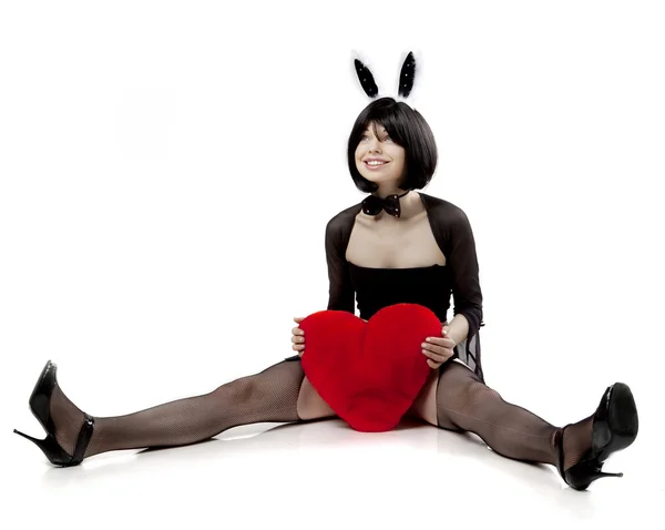 Menina coelho sexy com um coração nas mãos — Fotografia de Stock