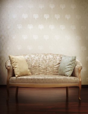 Luxury gold glamorous sofa in the background of vintage wallpape clipart