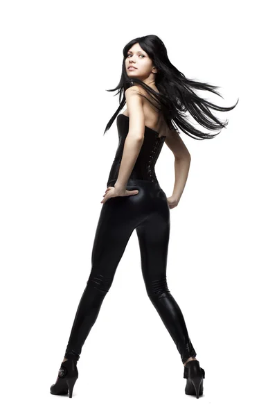 Elegante ragazza in pantaloni di pelle nera e corsetto — Foto Stock