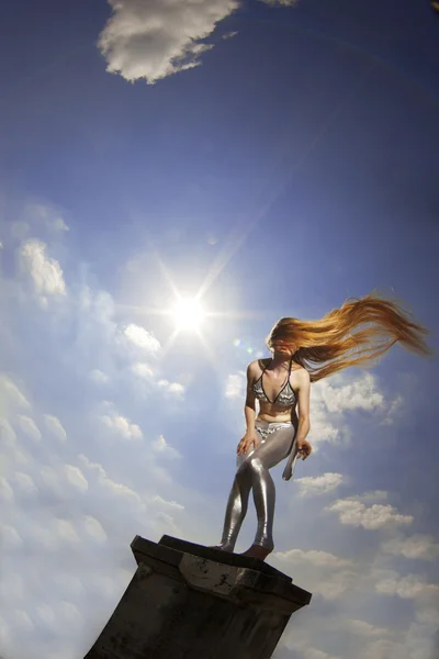 Girl with long hair against the sky — Stock Photo, Image