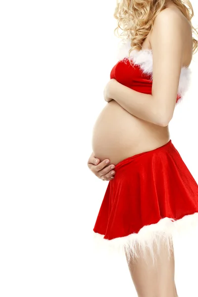 stock image Pregnant woman in a Christmas Santa suit