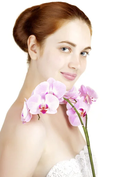 Flicka med orkidé — Stockfoto