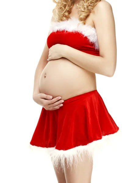妊娠中の女性、クリスマスのサンタをスーツします。 ストックフォト