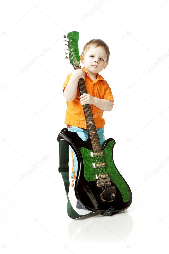 Little boy with a guitar on a white background