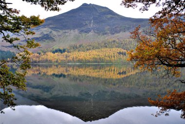 Reflection of a Mountain in a Water in District Cumbria clipart