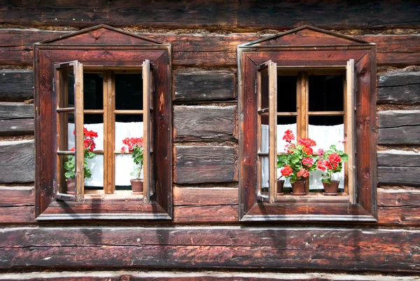 Two Traditional Opened Wodden Windows with Red Flowers — Stock Photo, Image