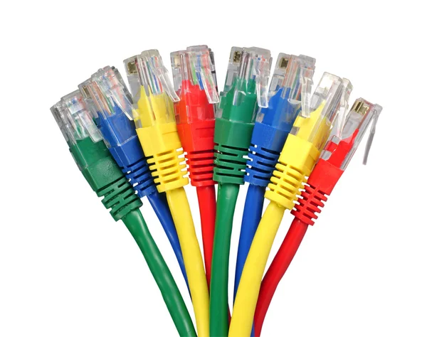 Conectores de red de computadora de color arco iris conectados a un enrutador o conmutador — Foto de Stock