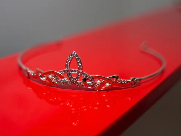 stock image Closeup on Silver Tiara on Red Background