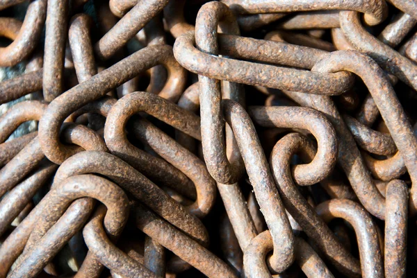 Closeup on a pile of rusty old chain — Stock Photo, Image