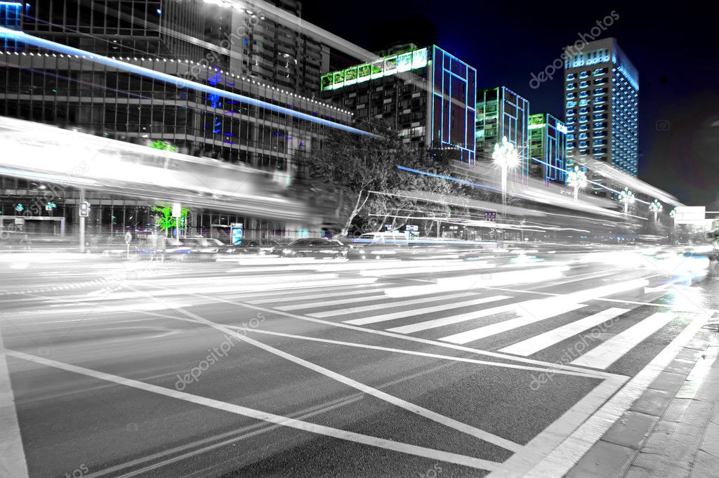 High speed and blurred bus light trails in downtown nightscape