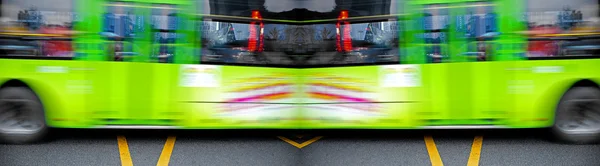 High speed and blurred bus trails on downtown road — Stock Photo, Image