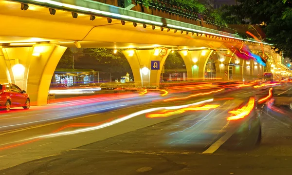 High speed traffic and blurred light trails under the overpass Royalty Free Stock Images