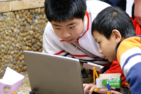 stock image Team ,partner and cooperation : boys concentrate on electronic d