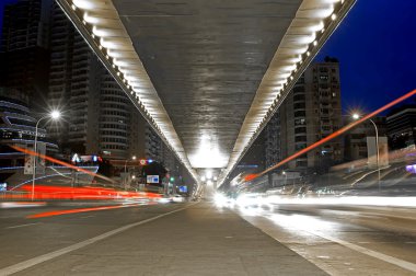 City night scene : flyover,light and hurtling car clipart