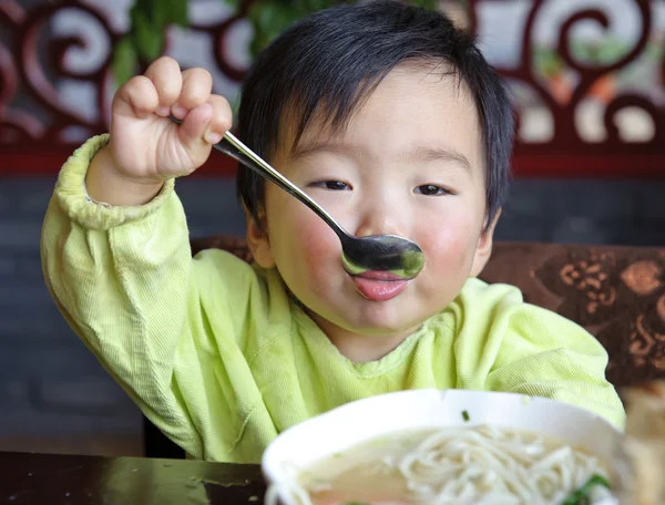 A cute baby is eating — Stock Photo, Image