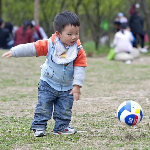 Stock image Baby playing football