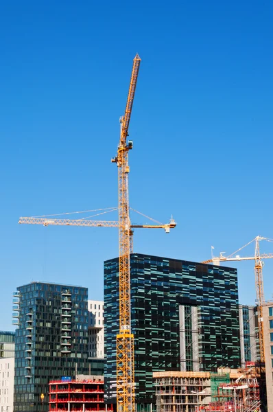 Buildings with two tower cranes — Stock Photo, Image