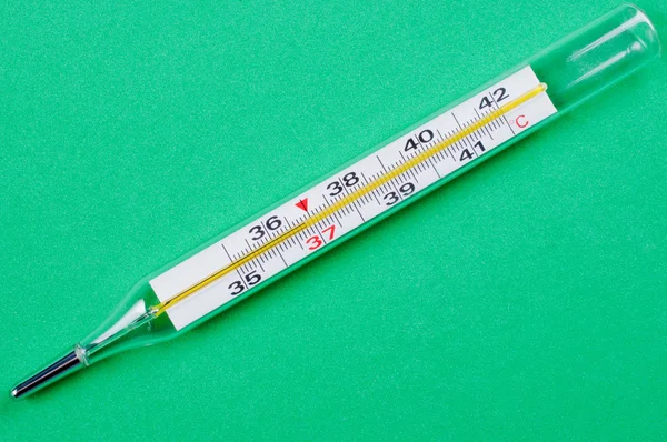 Thermometer close up on green background — Stock Photo, Image
