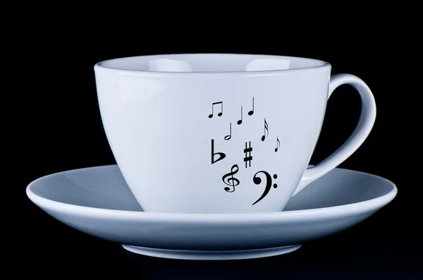 Siyah müzik notaları ile beyaz kupa — Stok fotoğraf