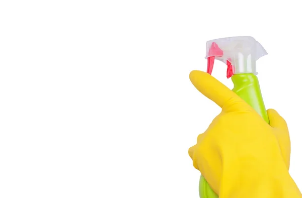 Hand in gele handschoen met groene spuittoestel geïsoleerd — Stockfoto